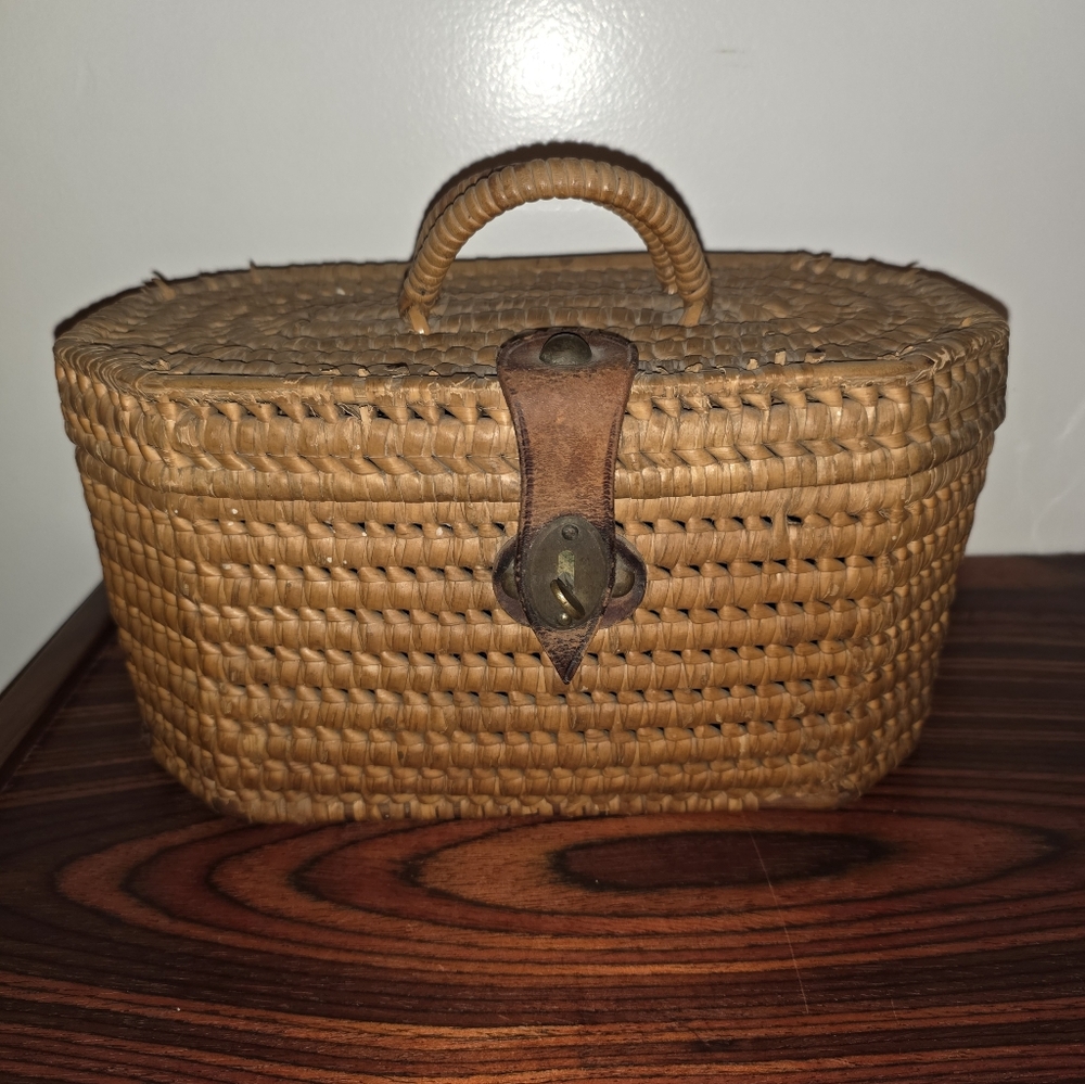 Antique tea basket/tea caddy, leather strapping closure.